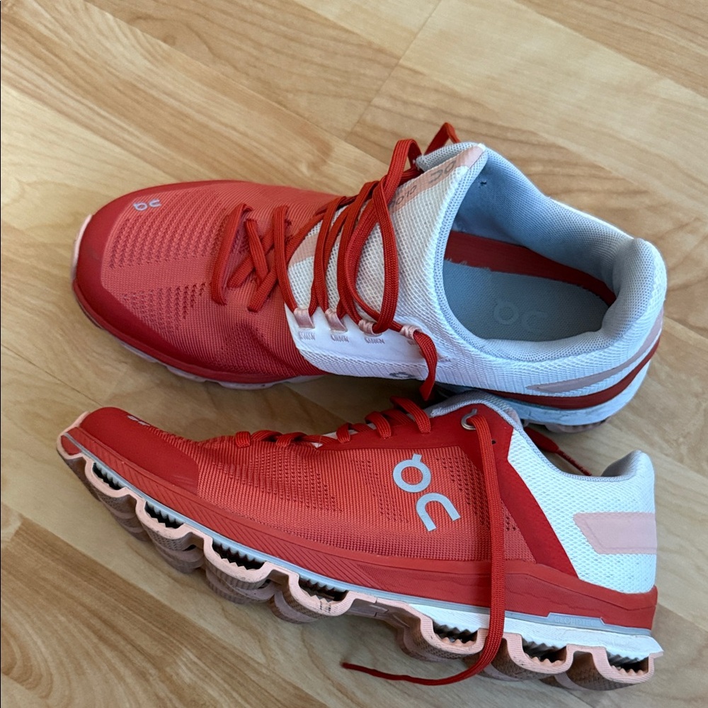 On Running Red and White Athletic Shoes